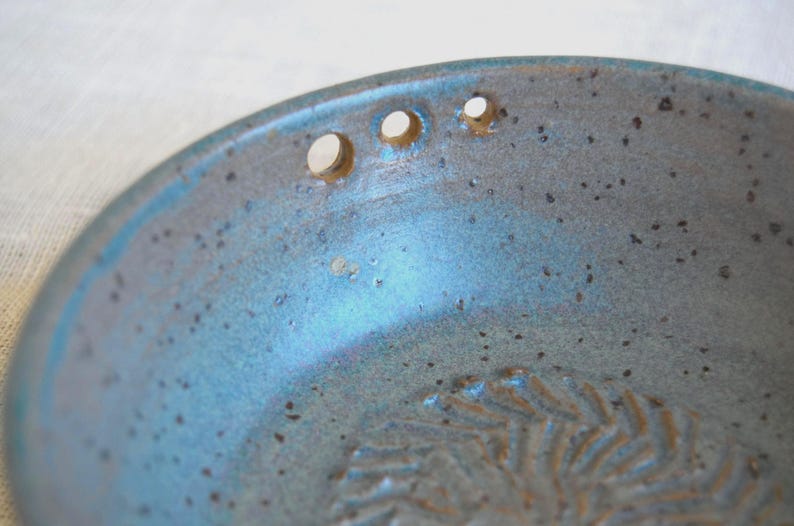Greenish blue garlic grater plate with herb stripper and spout in matte speckled finish